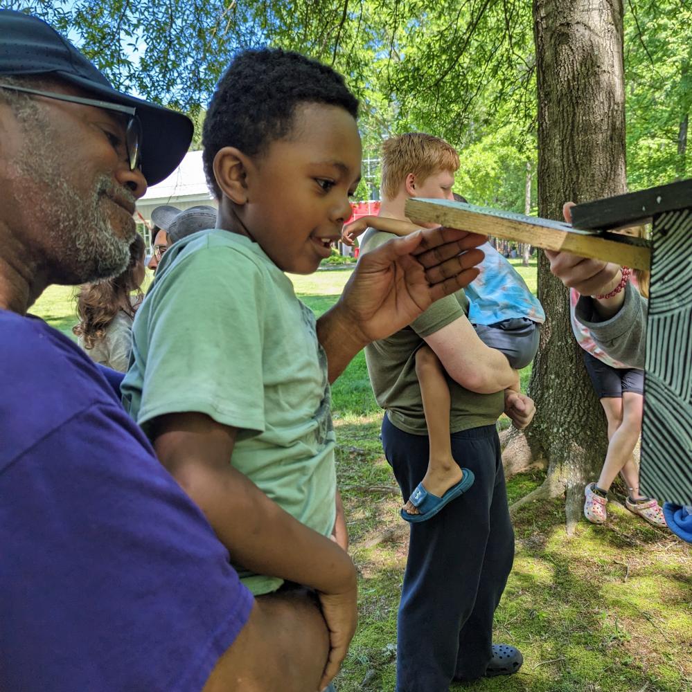 Caregivers and children exploring nature at Annmarie Sculpture Garden & Arts Center